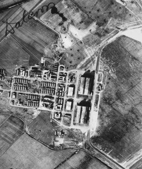 RAF WWII vertical aerial photograph of Dalcross Airfield.  Visible are the main hangars, part of the main runway and  the technical area to the NW.