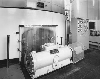 Interior. Generating hall, view of water turbine and control panel