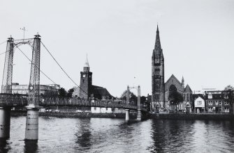 General view showing Old High Kirk, Free North Church and suspension footbridge