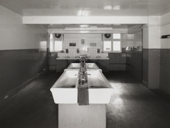 View from north east in Washroom of Traction Maintenance Depot, showing row of 
fireclay sinks (centre), and washbasins (along far wall)