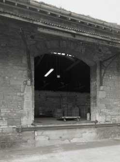 Detailed view from west south west of typical loading bay, showing arched entrance, 
and awning supported on cast-iron brackets (carried on projecting stone plinths)