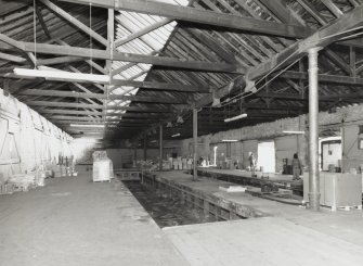 Interior general view from south west, showing 2 bays of king-post trusses 2 tracks, 
and central row of round cast-iron columns (0.26m diameter, and at approximately 
11.0m centres)