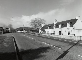 Inverness, Tomnahurich Swing Bridge over Caledonian Canal
Distant view of bridge from east, with neighbouring terrace of houses (right)