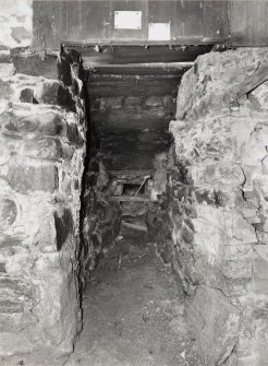 Basement, view of firebox of kiln.