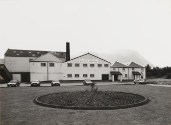 General view from NW of main block, including the two Tun Rooms, Mash House, Malt House and boiler House chimney.