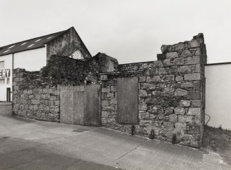 View from E of ruinous building (former cooperage) at NE end of Still House.