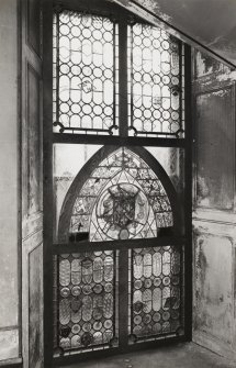 Ground floor staircase half-landing, view of stained glass window