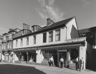 View of 'Peter Maclennan & Co. Ltd.' shopfront from WSW