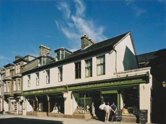 View of 'Peter Maclennan & Co. Ltd.' shopfront from WSW