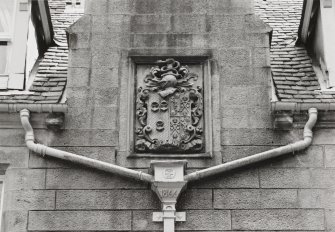 S front, carved armonial panel above rain-water head dated: 1866, detail