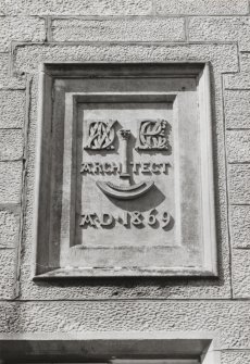 N front, carved panel with two sets of monograms; wording:"architect" and dated: 1869, detail