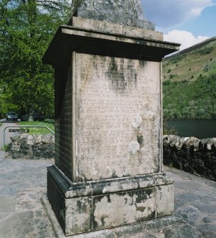 Detail of inscribed panel on base of monument (gaelic text)