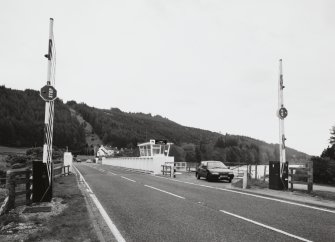 Laggan, Swing Bridge over Caledonian Canal
View from south looking along deck of bridge, with barriers in foreground, and control cabin (centre)