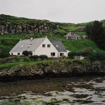 Muck, Port Mor. Port Mor House Hotel and building (NM 4208 7938) on terrace above. View from SE.