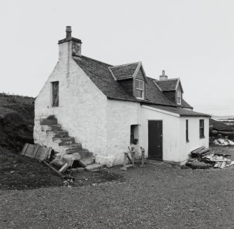 Muck, Port Mor, Pier Cottage. Cottage and gear store. View from NNW.