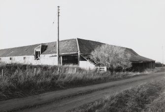 View from South East of corner of Threshing Barn with covered water wheel