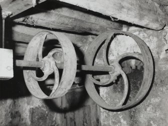 Deatil of flat belt pullies located under floor of Granary towards East end