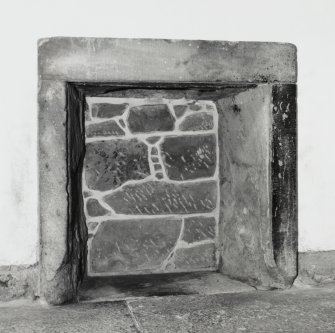 Interior-detail of fireplace on East wall of Ground Floor Eastern Cell