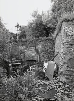 View of 'Jenny's Cottage' from N showing fireplace