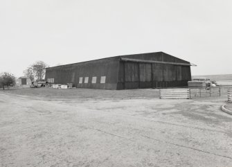 Evanton Airfield technical area (Naval).  View from NW of Pentad transportable all-steel  type hangar for Fleet Air Arm aircraft.  Designed with canted sides to accommodate aircraft with folded wings.