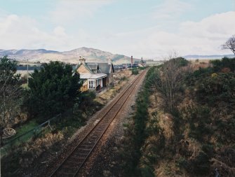 General view of station from ESE, with Balblair Distillery in the background