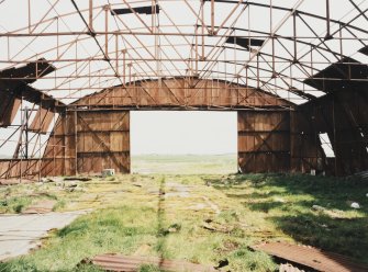 Fearn Airfield, W perimeter area, Mainhill type hangar showing interior and steel roof framing, view from SW.