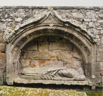 Fearn Abbey.  St. Michael's aisle, view of mural tomb with effigy of Abbot Finlay (d.1385) set into South wall.