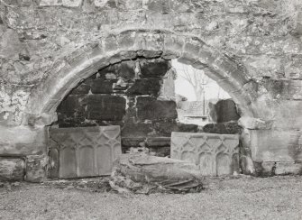 Fearn Abbey.  South East aisle, view of tomb recess in South wall from North.