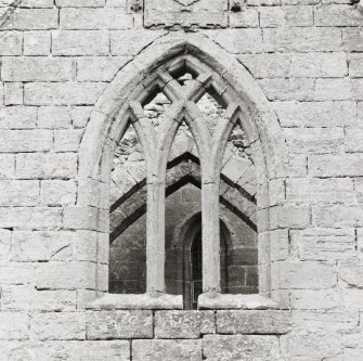 Fearn Abbey.  Ross aisle, detail of traceried window, Ross armorial, from North.
