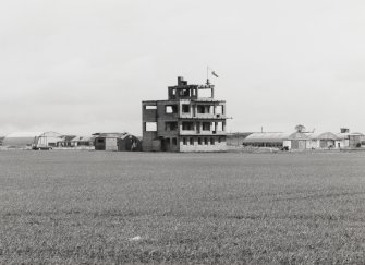 Fearn Airfield Naval Control Tower. General view from NW, showing hangar and torpedo sheds.