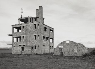 Fearn Airfield Naval Control Tower.  View from SE showing Nissen hut to rear.