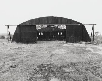 Fearn Airfield, W perimeter area, Mainhill type hangar. View from NE of semi-derelict hangar.