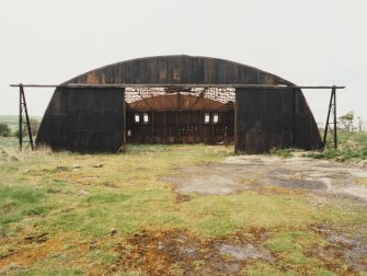 Fearn Airfield, W perimeter area, Mainhill type hangar.  View from NE of semi-derelict hangar.