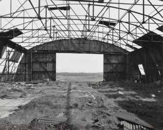 Fearn Airfield, W perimiter area, Mainhill type hangar showing interior and roof steel framing view from SW.