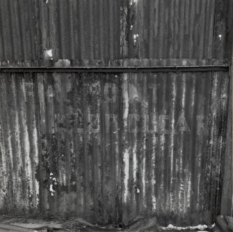 Fearn Airfield, W perimeter area, Mainhill type hangar. Interior showing surviving detail of 'Fire Point - Keep Clear' sign on wall.