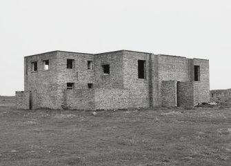 Fearn Airfield, SE technical area.  Brick and concrete technical building, view from W showing front elevation with opening for vehicle.