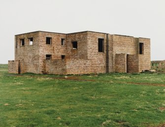 Fearn Airfield, SE technical area.  Brick and concrete technical building, view from W showing front elevation with opening for vehicle.