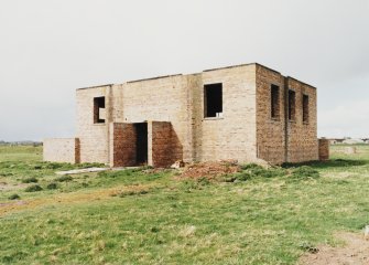 Fearn Airfield, SE technical area.  Brick and concrete built technical building, view from S showing vehicle entrance.