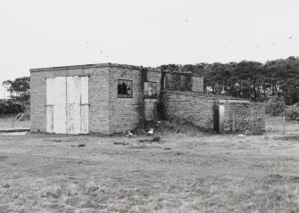 Fearn Airfield, Loans of Tullich accommodation camp.  View from NE of motor transport repair building and garage.  A small blast wall is visible on N wall of garage outshot.