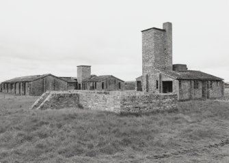 Fearn Airfield, Loans of Tullich accommodation camp.  View from SE of boiler house, mess halls and emergency blast shelter.