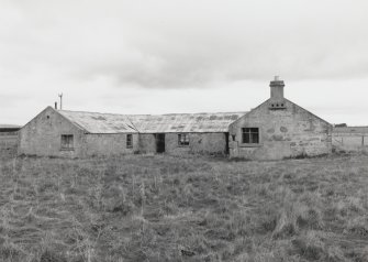 Loans of Tullich (Fearn Airfield accommodation camp).  Stoen built 19th century steading with subsequent internal alterations and additional windows resulting from re-use by the military during World War II. View from SE showing two gable ended legs and central section.  A small dovecot is visible on one gable end.