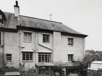 View from W showing Victorian house to N and 1930's house to S