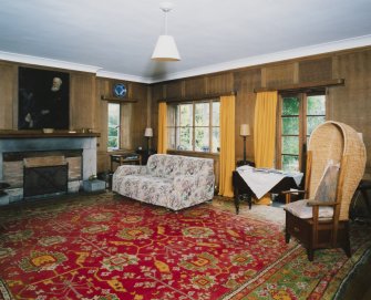 Interior. View of panelled lounge hall from NW showing french doors to garden terrace