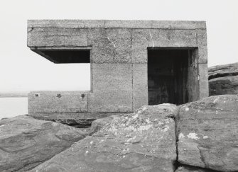 View from NW of searchlight emplacement showing entrance and foundation on bedrock