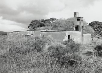 Tain Airfield Operations block, view from SE showing ventilation tower and entrance to engine room at E end.