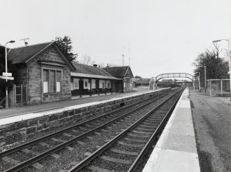 View from E of NE side of station, with tracks and platforms in the foreground