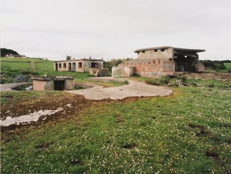 View from S showing remains of World War 1  9.2-inch gun emplacement with top of hoist for World War II magazine and  World War II gun emplacement and what is possibly the gun crew room.