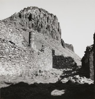 View from S within roofless remains of diatomite processing building, with kiln visible on the slope beyond