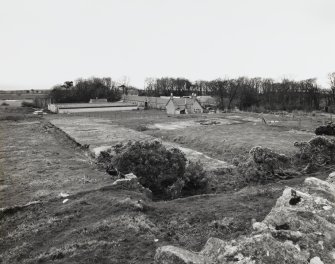 General view of steading from NNE, showing remains of World War II buildings in foreground.
See MS/744/117 and DC33078