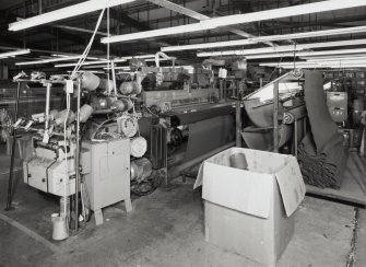 New Loom Flat: View of one of six Vamatex Looms, each fitted with darning tables to allow weavers to attend to minor imperfections in the cloth